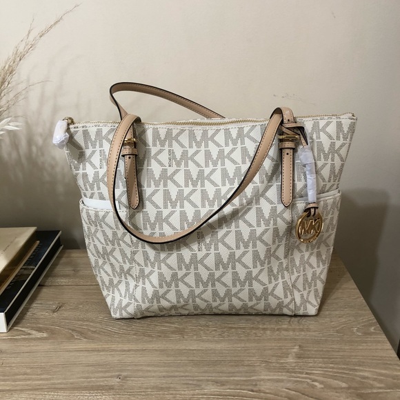 Michael Kors Handbags - NWT Michael Kors Monogram Bag